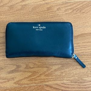 Beautiful Kate Spade black leather wallet. 7.5 inches by 4 inches. Zip-around